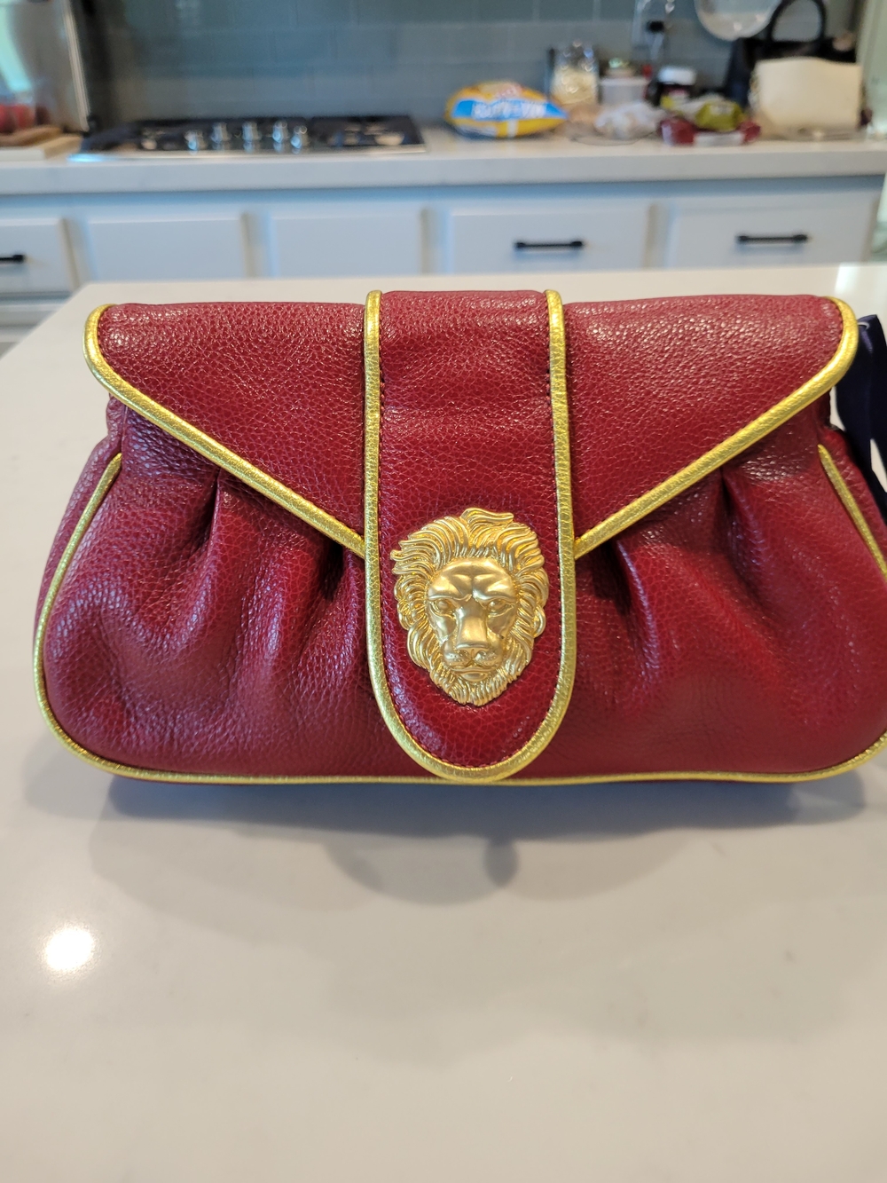 Dooney & Bourke Red Pebbled Leather Clutch with Gold Lion Detail
